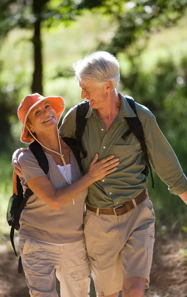 happy couple walking outdoors together secure retirement future